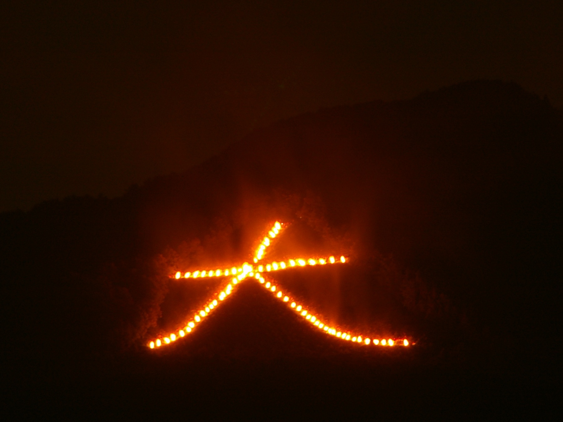 Gozan no Okuribi Daimonji character lit on Mount Daimonji in Kyoto